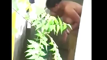 Big boobs Desi bhabhi nude irrigate neighbor boy caught by hidden cam